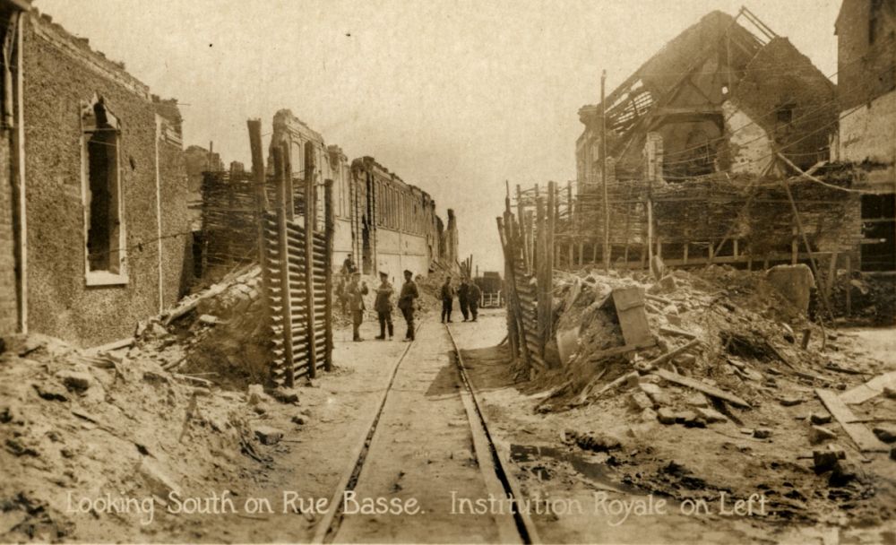 The German View: Messines, Belgium, during the German occupation in 1917, looking south on the Rue Basse. On the left are the ruins of the Institution Royale.